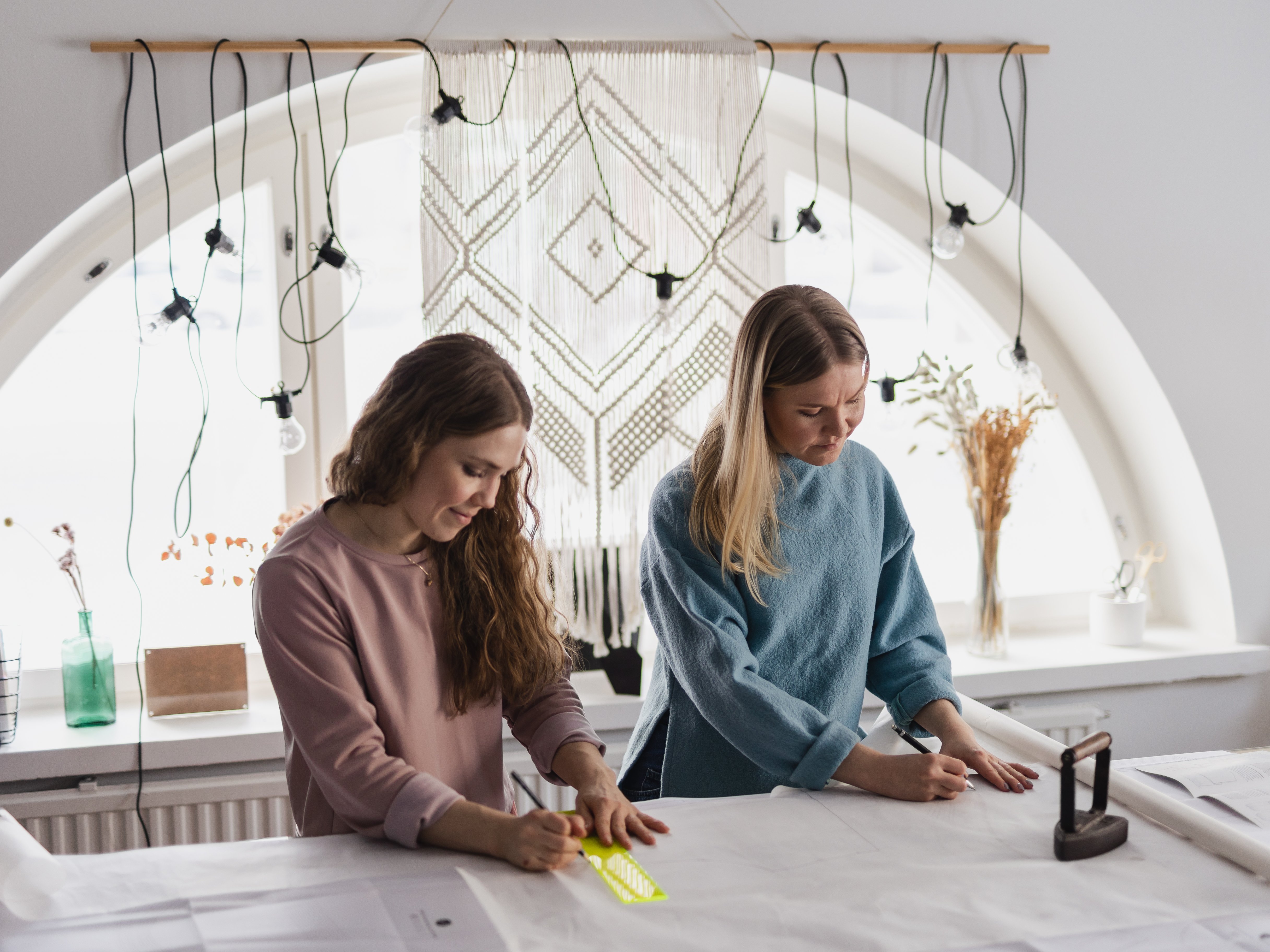 Laura and Saara, the sisters behind sewing pattern brand Named Clothing, designing.